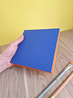 Carnet carré 15×15 aquarelle – Bleu marine & Orange